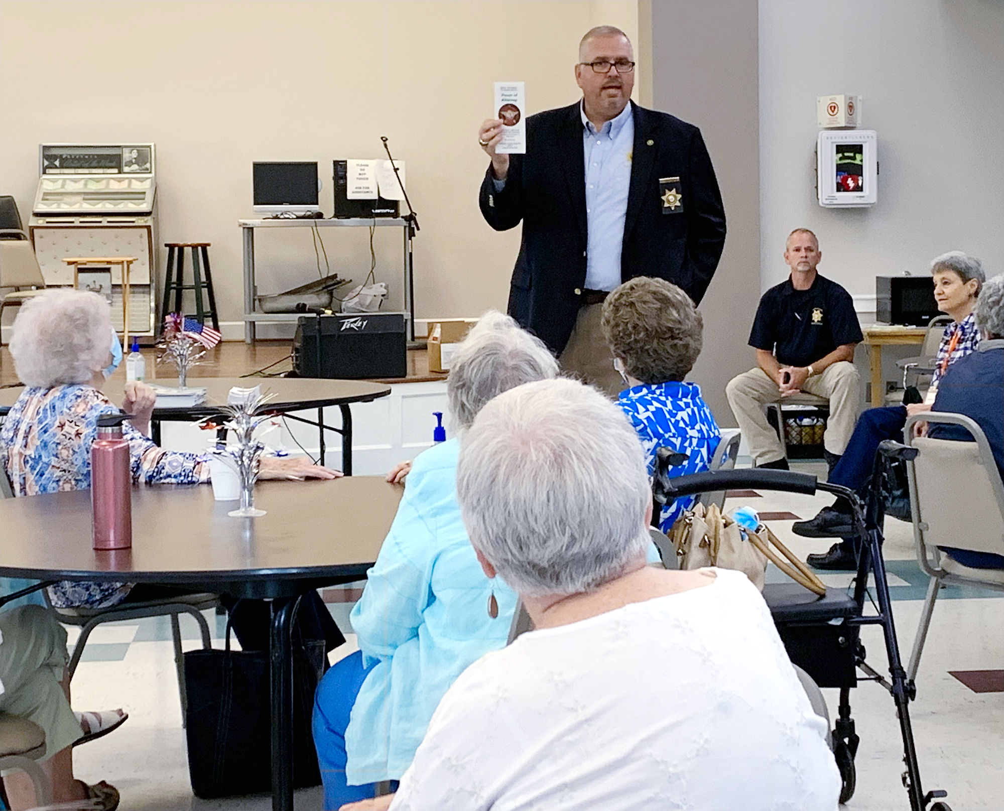 Sheriff Gary Sisk talks with people at the Catoosa County Senior Center.