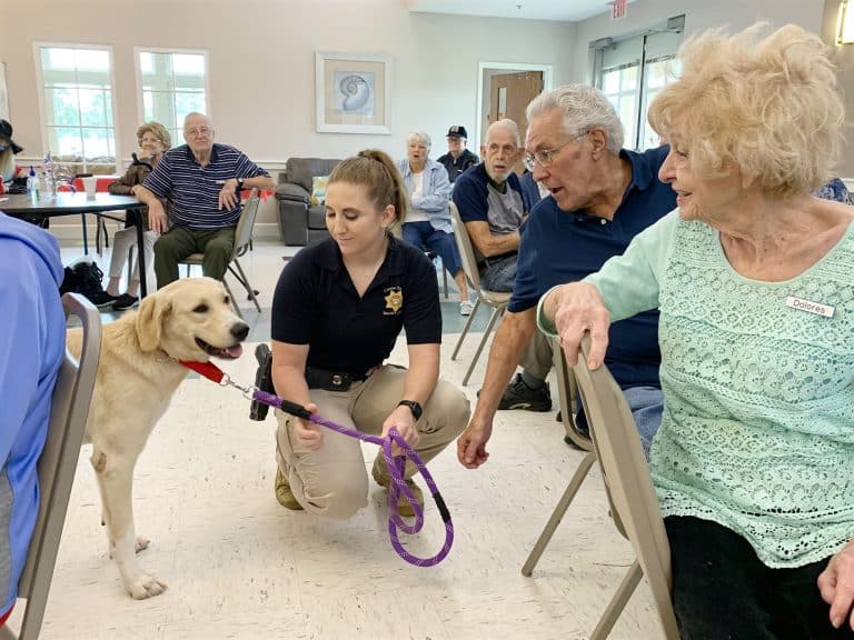 police dog interacting with people
